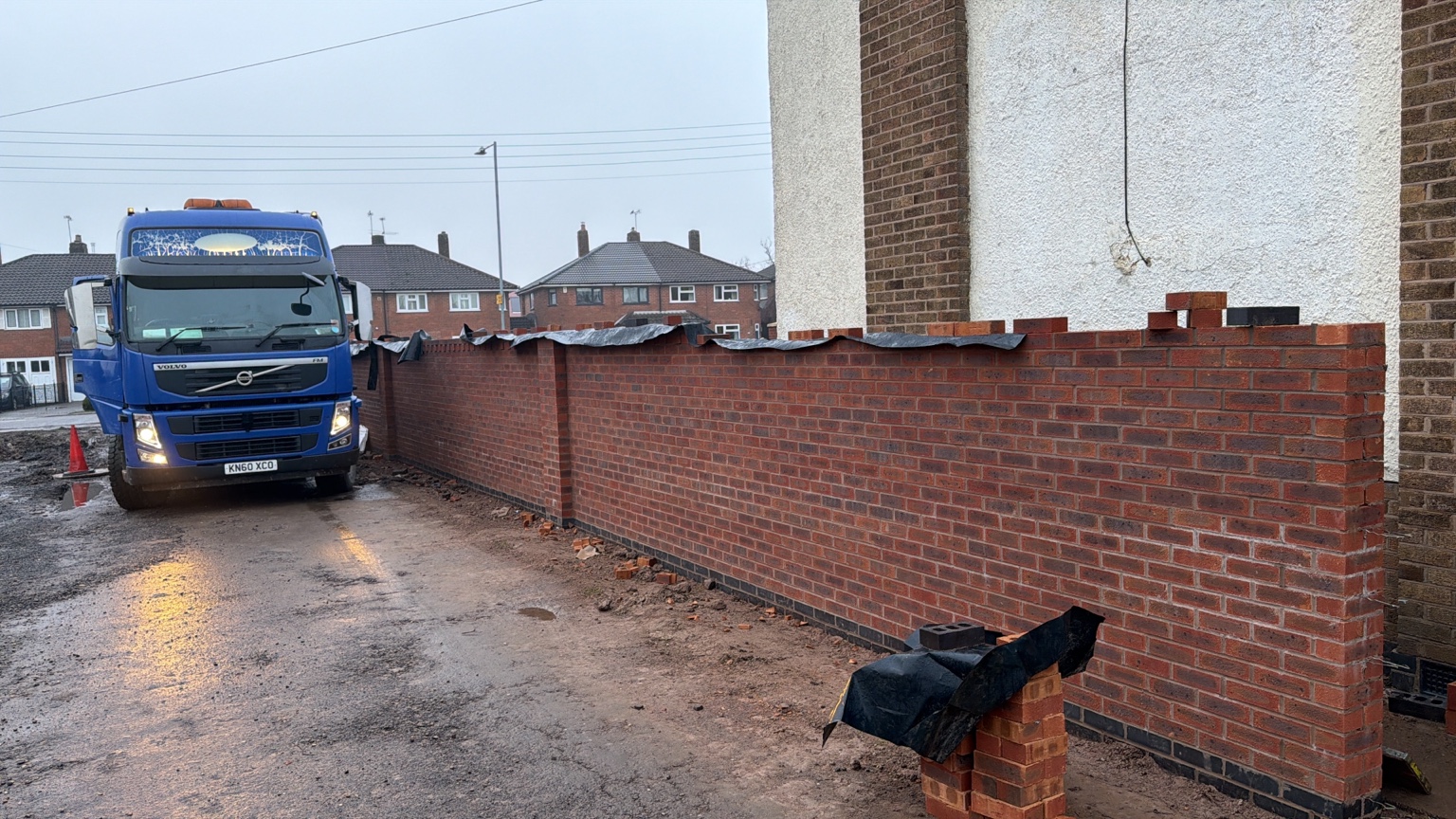 AGP delivery beside a newly built brick wall